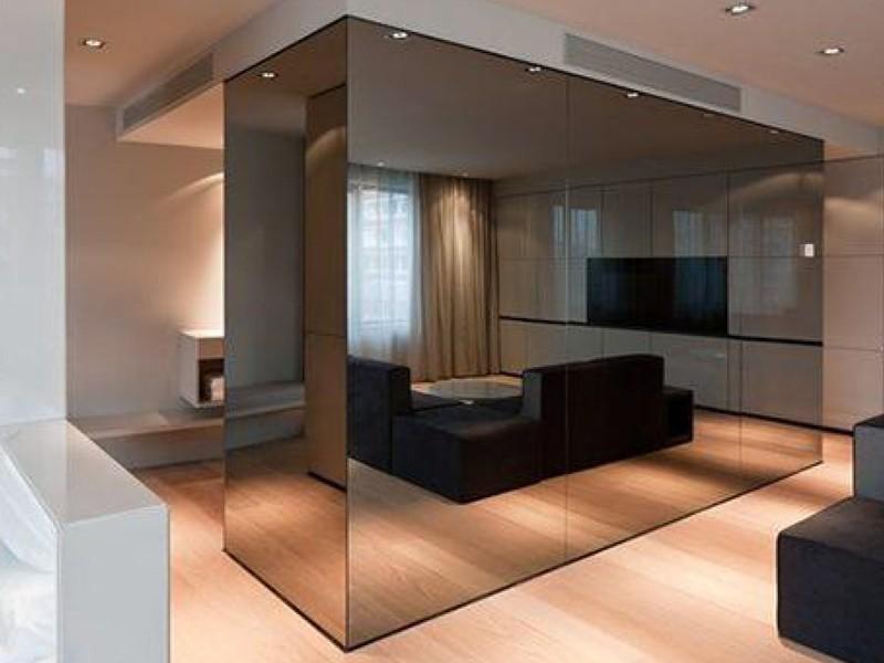 Mirror stainless steel wall panels behind retail display shelving